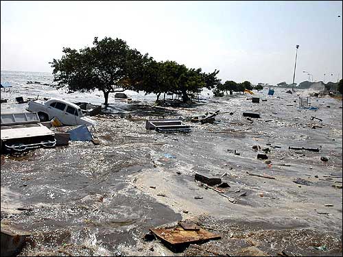 A general view of the scene at the Marina beach in Madras after tidal waves hit the region. Tidal waves devastated the southern Indian coastline, striking just after dawn as a huge earthquake in Indonesia sent tsunamis crashing westward, sweeping men, women, and children out to sea.