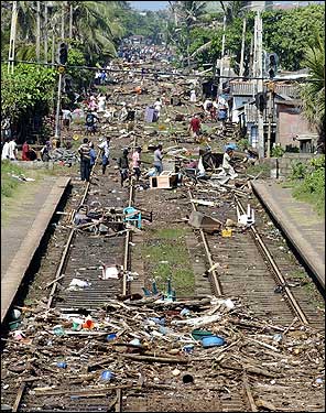The trail of destruction along the coastal railway line is evident in this photograph, taken at Lunaw.