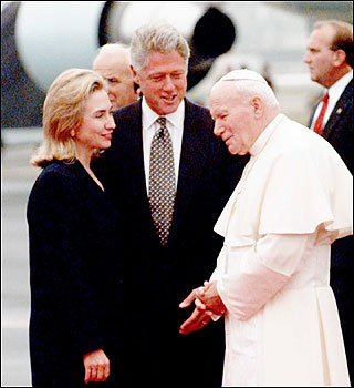 Former First Lady Hillary Clinton and President Bill Clinton greeted the pope at an airport in Newark, N.J., on the start of his four-day visit to America.
