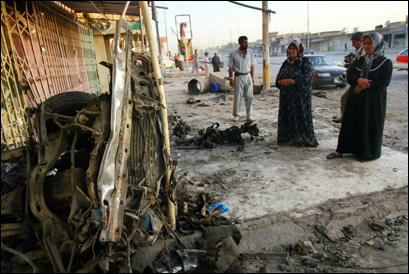 Iraqi residents inspected the remains of a vehicle used in yesterday's car bomb attacks in crowded markets in the oil hub of Kirkuk, 255 kms (160 miles) north of Baghdad, 16 August 2007. Iraqi residents inspected the remains of a vehicle used in yesterday's car bomb attacks in crowded markets in the oil hub of Kirkuk, 255 kms (160 miles) north of Baghdad, 16 August 2007.