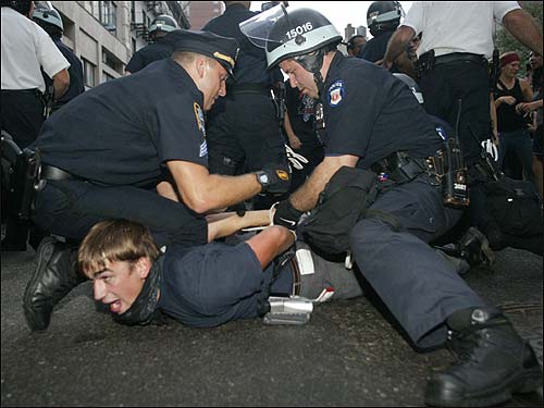 A demonstrator is handcuffed
