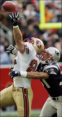 49ers tight end Eric Johnson (82) can't make the catch as Patriots safety Rodney Harrison, right, breaks up the play.