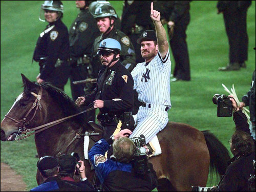 New York Yankees Wade Boggs rides a police horse around the field after the Yankees defeated the Atlanta Braves 3-2 in Game 6 of the World Series to win the Series at Yankee Stadium in New York, Saturday, Oct. 26, 1996.