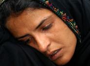 Mukhtar Mai, victim of a gang rape, sheds tears after a court's decision in Multan, Pakistan on Thursday, March 3, 2005. The Pakistani court on Thursday overturned the conviction of a village elder and four other men who had been sentenced to death for allegedly ordering a woman gang-raped as punishment for her brother's illicit sex with a woman from another family, a defense lawyer said.