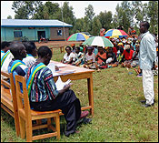 JUSTICE ON THE GRASS, 2005 | Rwanda has set up semi-traditional community courts known as gacaca courts to try roughly 63,000 people accused of involvement in the genocide. Above, scene from a trial in Zivu, southern Rwanda, on Thursday.