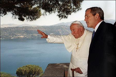 Pope John Paul II and President Bush during their first meeting at the Pontiff's summer residence in Castel Gandolfo, near Rome, in July 2001.