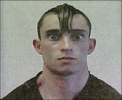 Gregory Despres is shown in this image from television. On April 25, 2005, Despres arrived at the US-Canadian border crossing at Calais, Maine, carrying chain saw stained with what appeared to be blood, a homemade sword, a hatchet, a knife, and brass knuckles.