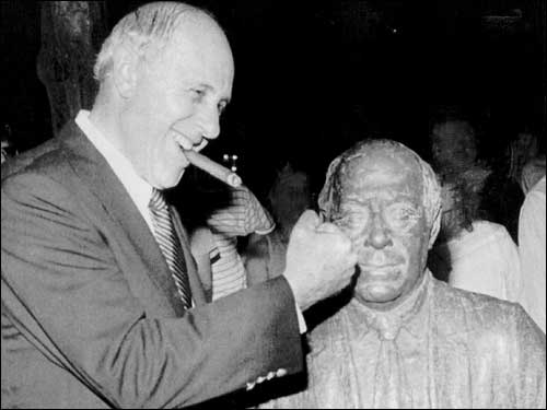 Auerbach playfully threw a punch at a lifesize statue of himself erected at Fanueil Hall in 1985.