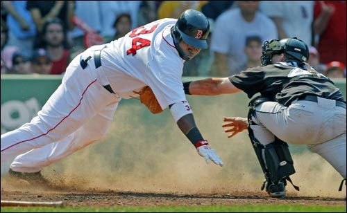 David Ortiz is tagged out at the plate by Blue Jays catcher Jason Phillips while trying to score the tying run on an Eric Hinske single in the sixth inning.