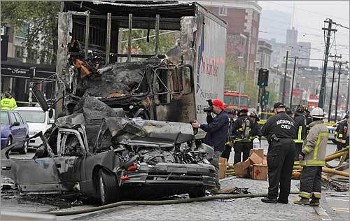 A medical supply truck caused a series of accidents Thursday morning as it careened down several blocks of Commonwealth Avenue, striking a half dozen cars before it burst into flames. At left, hazmat specialists surveyed the charred vehicles on Brighton Avenue in Allston.