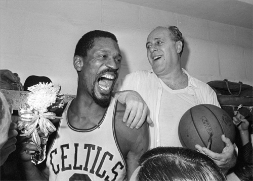 Boston Celtics player Bill Russell (left) celebrated with Celtics coach Red Auerbach after defeating the Lakers 95-93 to win their eighth-straight NBA Championship in Boston on April 29, 1966.