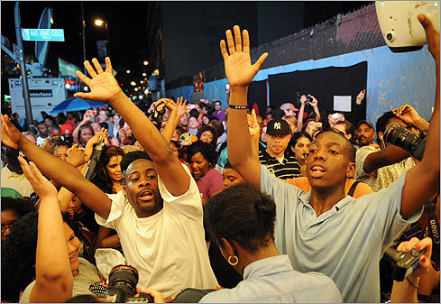 People gathered and sang in front of the Apollo Theater in the Harlem section of New York City on June 25.