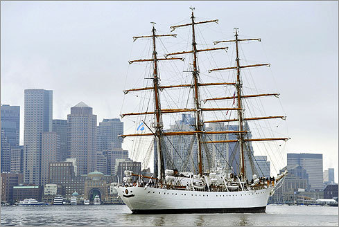 The Libertad passed in front of the gloomy financial district skyline.