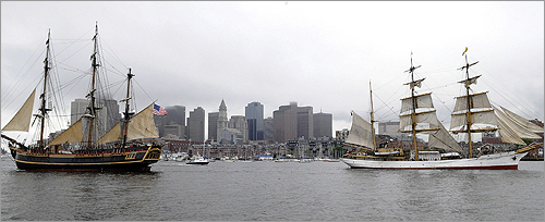 The Bounty, of Greenport, N.Y., left, and the Picton Castle, from Lunenburg, Nova Scotia, right, made their way into Boston Harbor today. For a while, their arrival was in doubt, but the first Tall Ships arrived under heavy rainfall Tuesday morning.