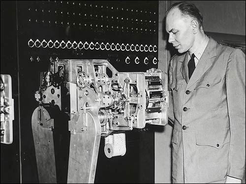 Harvard mathematician Howard Aiken with his MARK I computer.