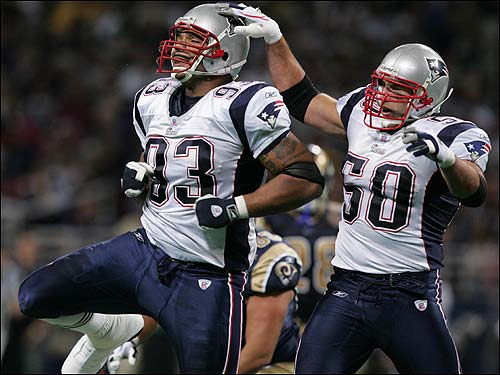 Richard Seymour gets a pat on the helmet from Mike Vrabel after Seymour's fourth-quarter sack.