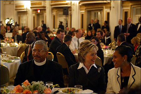 Hillary Rodham Clinton, flanked by the Rev. Eugene F. Rivers 3d and Jacqueline Rivers, at the Ella J. Baker dinner.