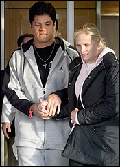 New England Patriot Tedy Bruschi left Mass. General Hospital yesterday with his wife, Heidi.