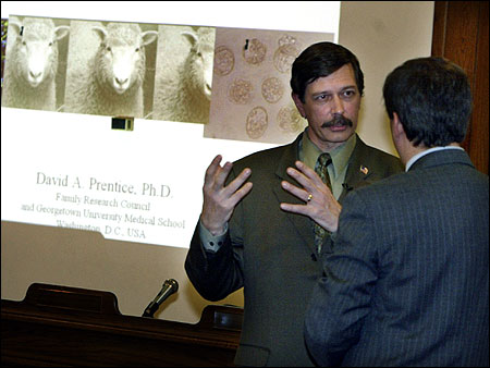 David A. Prentice (L) — a senior fellow at the Family Research Council, which opposes a Senate bill to promote embryonic stem cell research — talked with state Senator Bruce E. Tarr prior to giving a presentation at the State House Tuesday.