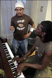 Departing Berklee School of Music student J.C. Casely at a voice lesson with asstant professor Marlon Saunders.
