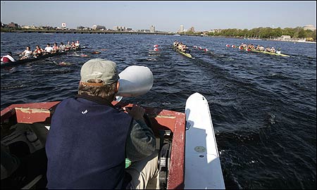 From his launch, coach Harry Parker has a front-row seat as his national champions sprint toward the Massachusetts Avenue bridge.