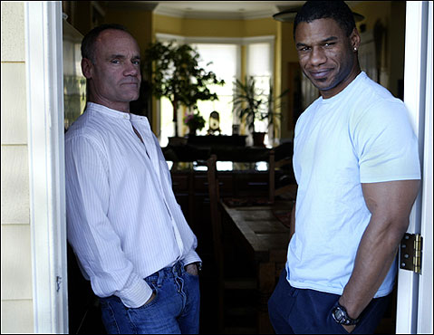 Just the idea of a biracial gay couple moving into South Boston would have been unthinkable in the not-too-distant past, but Jim (left) and Edwin Tucker Bradley have blended in like any other young couple.