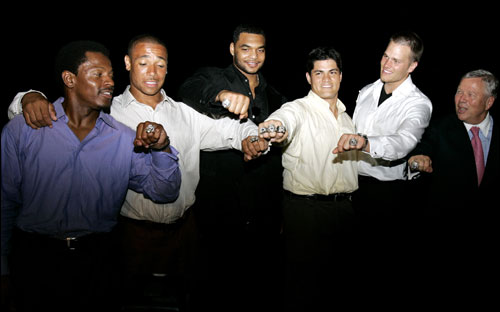 From left, Troy Brown, Rodney Harrison, Richard Seymour, Tedy Bruschi, Tom Brady and team owner Robert Kraft show off their 4.94-karat diamond Super Bowl rings. The team gathered to collect their rings at Kraft's house in Brookline last night. According to Jostens, which has made 26 of the 39 Super Bowl rings, this year's is the heaviest ever at 4.06 ounces. (From The Boston Globe)