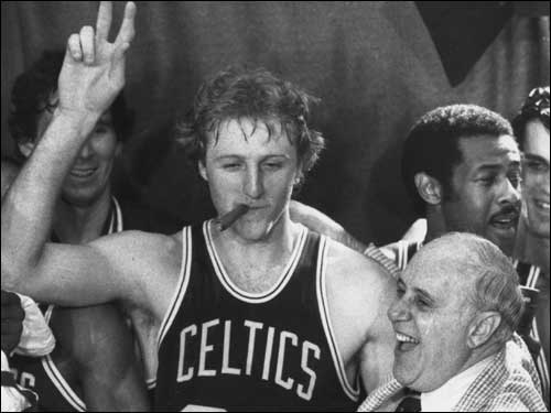 Larry Bird celebrated the Celtics' 14th championship in 1981 with one of Auerbach's signature cigars.