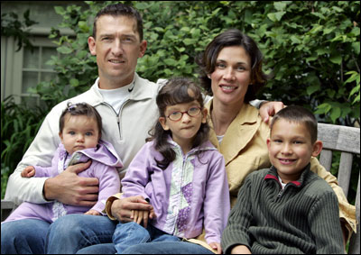 ‘I’m constantly amazed at her disposition. She’s uncomfortable, she’s having a hard time . . . but yet, she’s got a smile for you. I’m really blessed to have a child like her.’ -- John Olerud, on his daughter Jordan (with glasses, sitting with mom Kelly and her siblings, Jessica and Garrett)