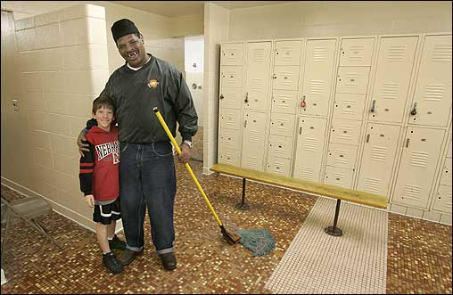 Here Spinks poses with Ryan Steiner, 9. ''I'd love to teach kids how to box here,' he said. 'There's nothing to do here but get in trouble.'
