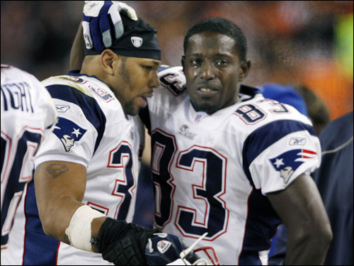As the clock wound down in the game, wide reciever Deion Branch (right) was in tears as he and running back Kevin Faulk consoled each other.
