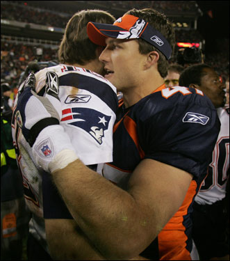 Broncos safety John Lynch, right, embraced Patriots quarterback Tom Brady.