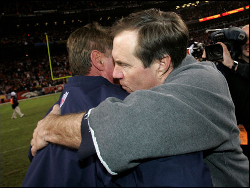 Bill Belichick hugged Mike Shanahan after the Broncos defeated the Patriots 27-13 to advance to the AFC Championship game.