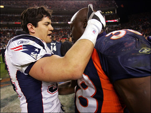 Linebacker Tedy Bruschi went to hug Denver running back Mike Anderson after the game.