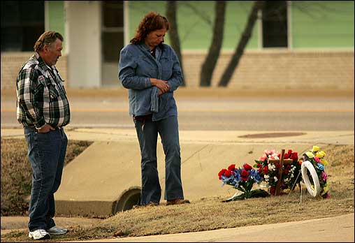 Jacob Robida's rampage left a trail of mourners, first for victims in New Bedford, and now for fallen police officer James Sell , who was shot while pursuing Robida in Arkansas. At left, Tammy and Cindy Acuff of Flippin, Ark., paid their respects to Sell at a makeshift memorial.