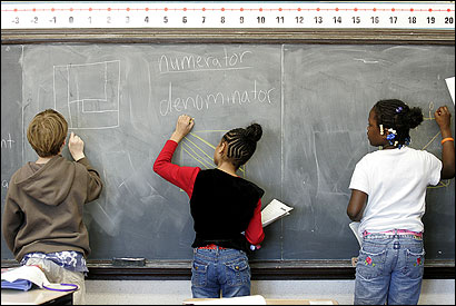 From left, Demetri Exarhoulakos, 11, Tianna Dunbar, 10, and Marquisha Bowen, 9, worked on a math problem at the Ludwig van Beethoven School in West Roxbury last month.