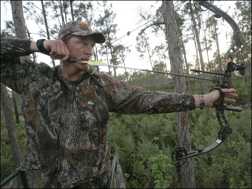 Timlin took aim in the woods of Wingshooters Hunting Preserve. ''I enjoy being out among God's creations,'' Timlin said.