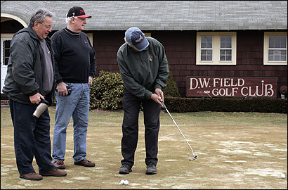 Bob Wallace practiced his short game at D.W. Field Golf Course in Brockton yesterday with Ron Perron (left) and Mike Burns.