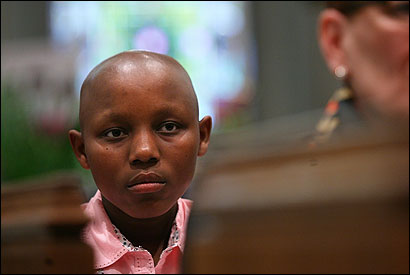 Claudine Humare, a 14-year-old Rwandan being treated for cancer, attended yesterday’s Mass at St. Peter’s Church in Cambridge.