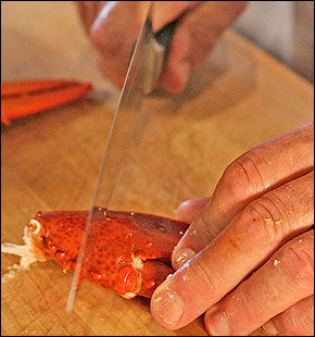 Chef Sam Hayward uses the back of a heavy knife to crack open the lobster claw, but lobster crackers, and even nut crackers, work just as well.