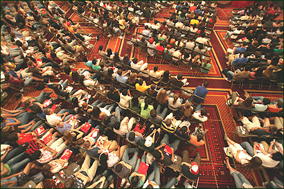 Incoming students at Boston University listened (above) to Daryl J. Deluca, director of judicial affairs, deliver a speech on safety and behavior. As part of his lecture, Deluca displayed hundreds of confiscated ID’s as a warning to students.
