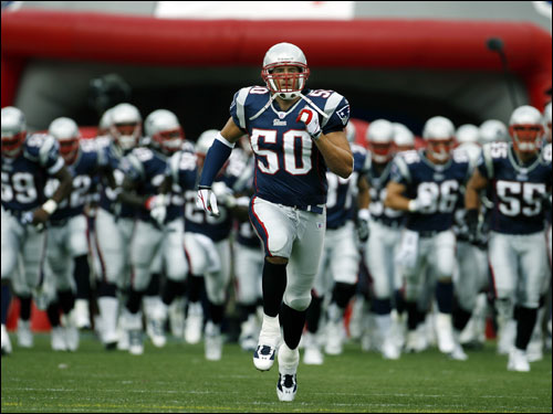 Patriots co-captain Mike Vrabel (50) led the defense onto the field for the season opener at Gillette Stadium.