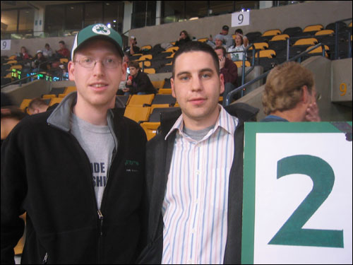 Celtics fans Dave Dumoulin (left) and Roei Biberstain of Newton brought a sign to remember Auerbach. The Celtics retired Auerbach with the number two.