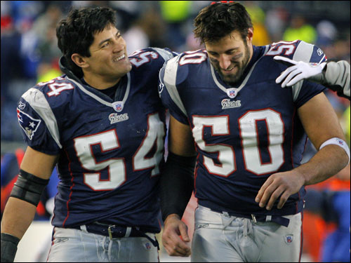 Patriots linebacker Mike Vrabel (right) who had two interceptions in the game, including one on the last play Detroit ran in the game that sealed the victory, got a pat on the head from fellow linebacker Tedy Bruschi (left) after the game. Vrabel was shaken up on the final interception, and was on the ground for quite awhile, before being helped to the bench, but by the time the final gun sounded, he seemed to be feeling better.
