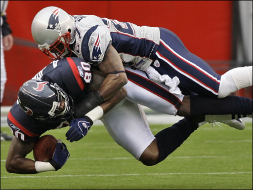 Patriots corner Ellis Hobbs delivered a hit at the line of scrimmage on Texans wide receiver Andre Johnson.