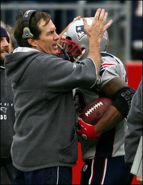 Patriots head coach Bill Belichick congratulated Kevin Faulk after his second touchdown.