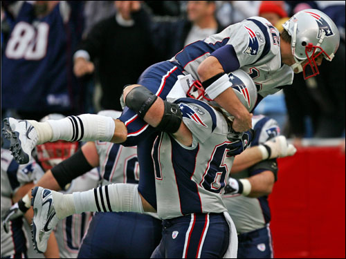Tom Brady celebrated his 43-yard touchdown pass to Kevin Faulk with Stephen Neal.