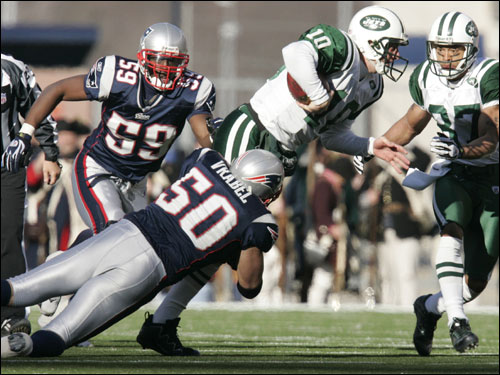 Patriots linebacker Mike Vrabel tackled Jets quarterback Chad Pennington.