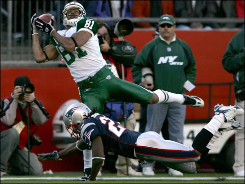 Justin McCareins (top) of the New York Jets was unable to stay in bounds as he catches the ball over Asante Samuel.