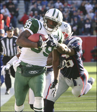 Jets wide receiver Jerricho Cotchery caught a Pennington pass and took off for a 77-yard touchdown in the first half. He eluded a tackle at the goal line by Patriots safety James Sanders.